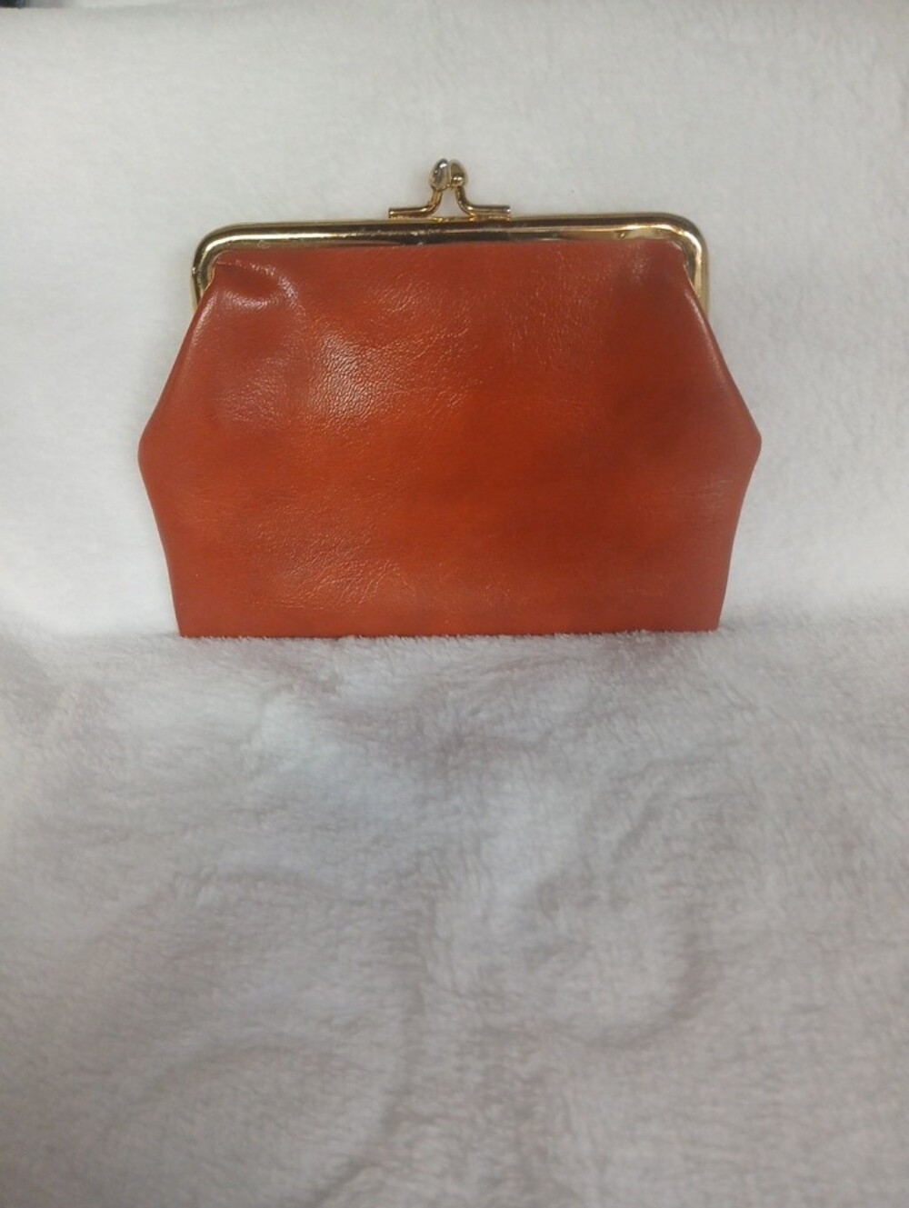 Vintage leather orange/rust color coin/wallet/pouch with gold-color snap